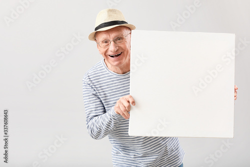 Portrait of elderly man wit...