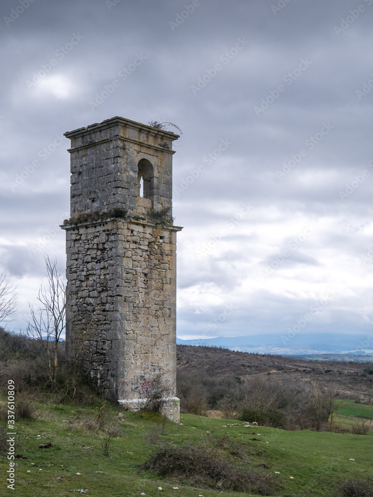 Old church tower of the abandonded haunted village of Ochate, Trevino Country, Burgos, Spain