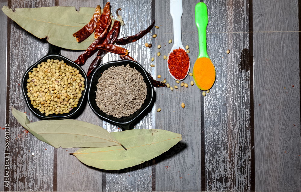 Herbs and Spices with colorful wooden background