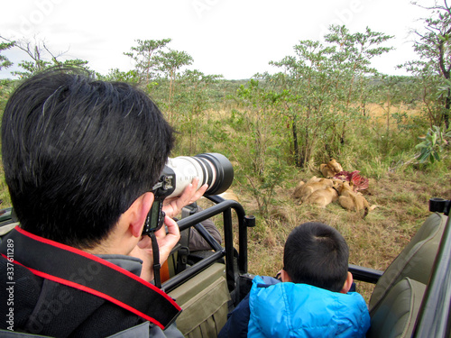 Photographer taking safari pictures in Kruger NP, South Africa