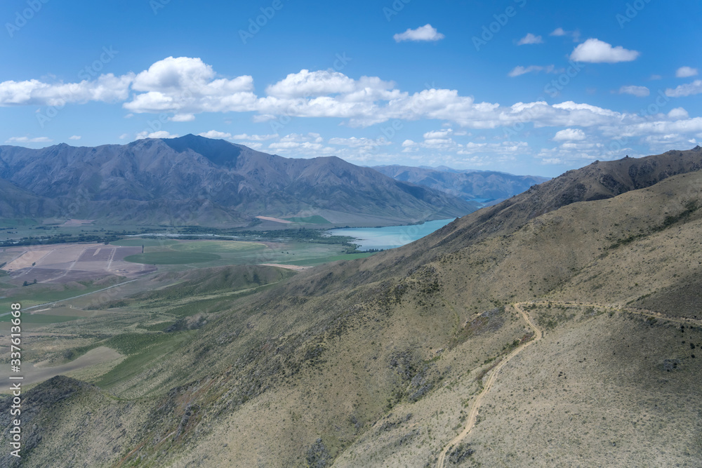 barren slopes of St. Cuthbert peak and Benmore lake, from north-west,  New Zealand