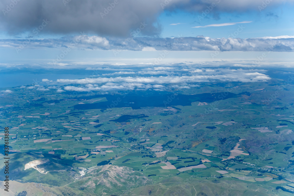 low clouds shade plains near Palmerston,  New Zealand