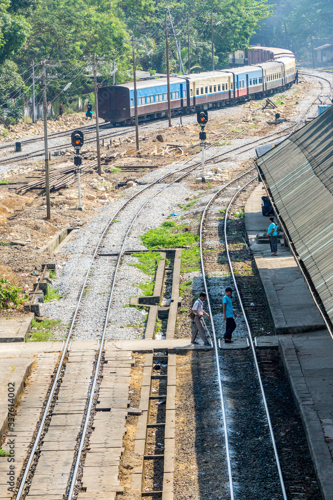 Fototapeta premium A train coming to flatform at the Central Railway Station in Yangon, Myanmar. Yangon is the country main centre for trade, industry and tourism.