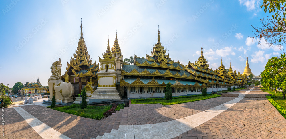 Naklejka premium Shwedagon pagoda at sunset. This place is popular destination landmark in Yangon, Myanmar