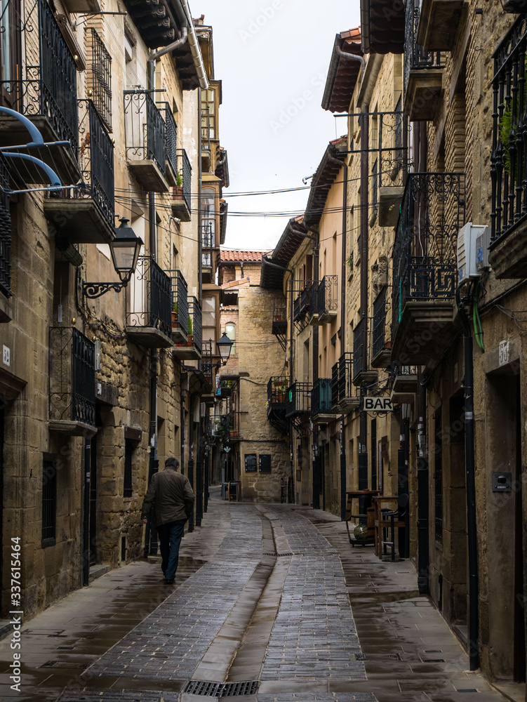 View of a narrow street in the old town of Laguardia, Rioja Alavesa, Basque Country, Spain