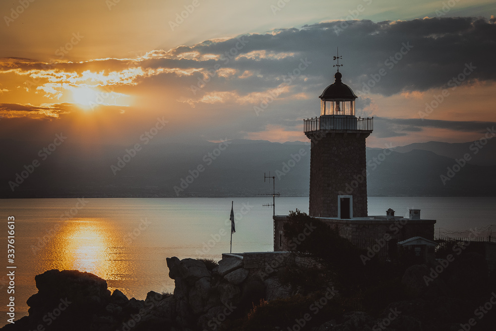 Lighthouse Melagavi at sunset in Loutraki Greece near Iraion lake