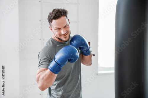 Male boxer training in gym