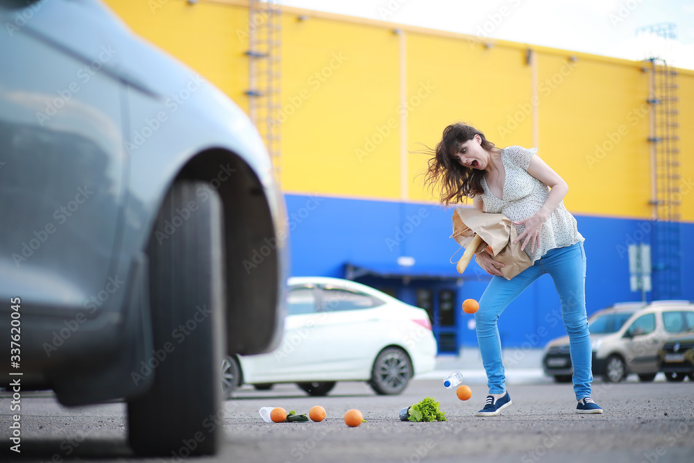 Pregnant woman with shopping comes from the store Pregnant woman with shopping comes from the store