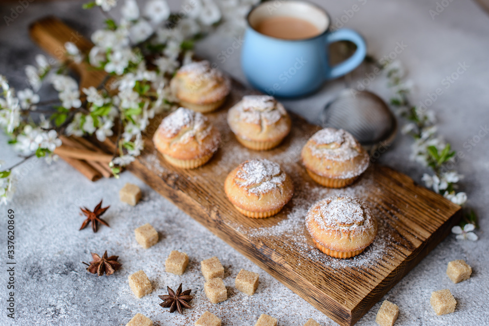 Fresh baked cupcakes of rice flour with banana and vanilla with a mug of hot chocolate Fresh baked cupcakes of rice flour with banana and vanilla with a mug of hot chocolate