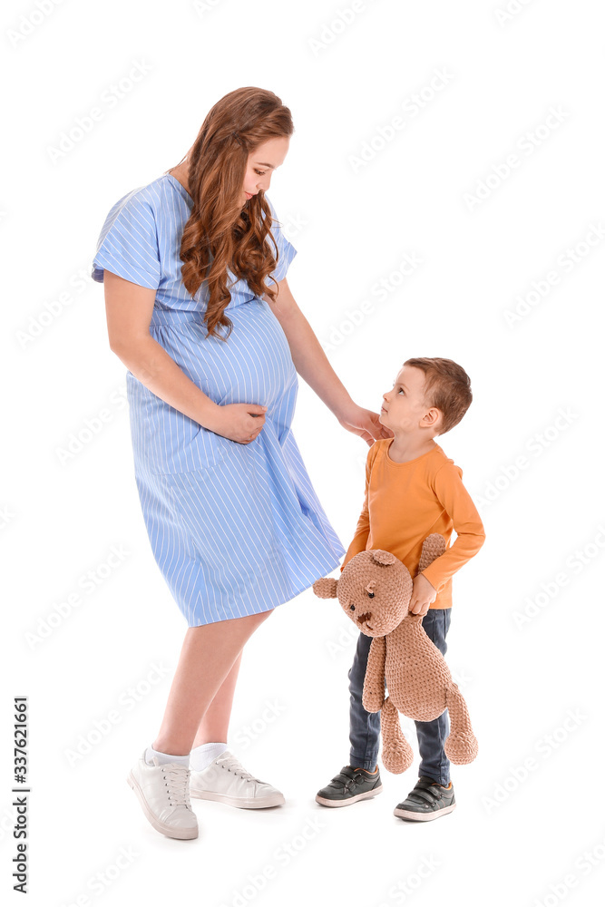 Beautiful pregnant woman and her little son on white background Beautiful pregnant woman and her little son on white background