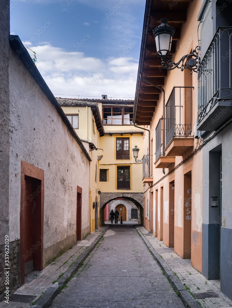Fototapeta premium Colorful buildings in a small narrow street in the old town of Jaca, Huesca, Aragon, Spain