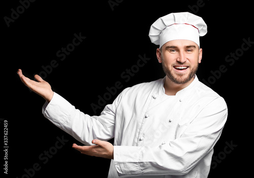 Handsome male chef showing ...