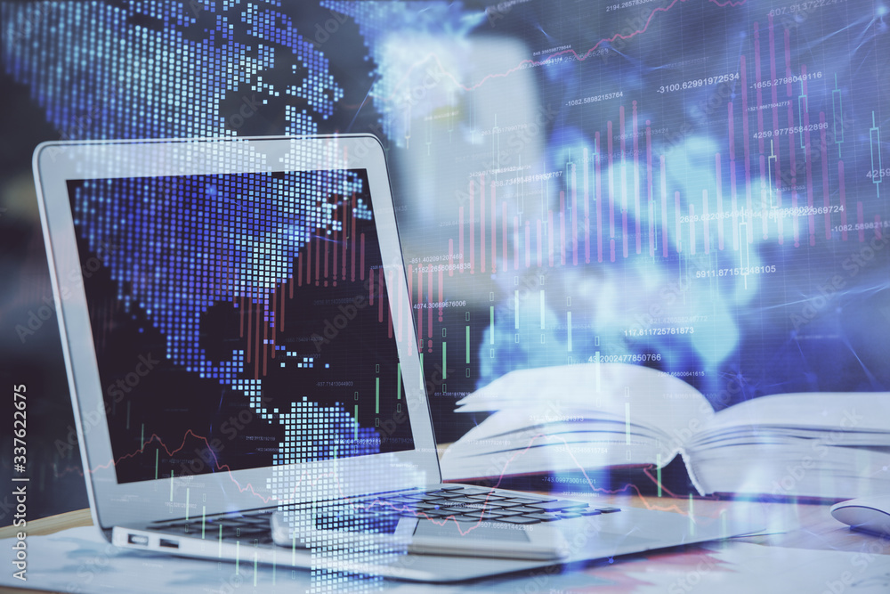 Forex graph hologram on table with computer background. Double exposure. Concept of financial markets. Forex graph hologram on table with computer background. Double exposure. Concept of financial markets.