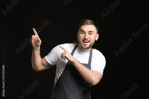 Handsome male chef pointing...