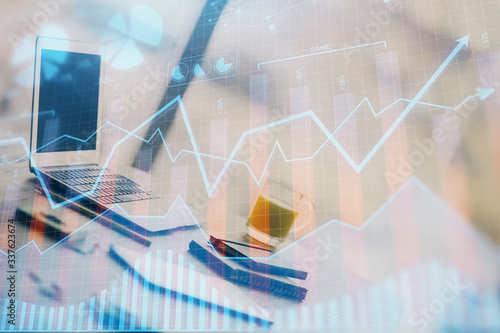 Forex Chart hologram on table with computer background. Double exposure. Concept of financial markets.