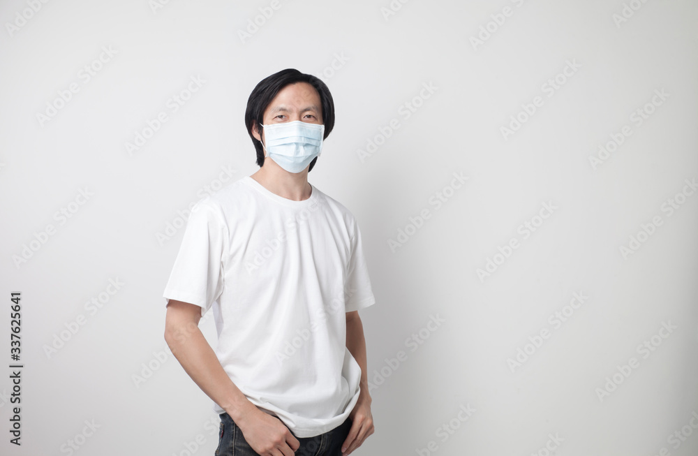 Man wearing a white T-shirt, wearing a mask White background Man wearing a white T-shirt, wearing a mask White background