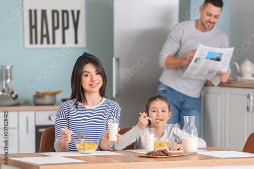 Family drinking milk during...