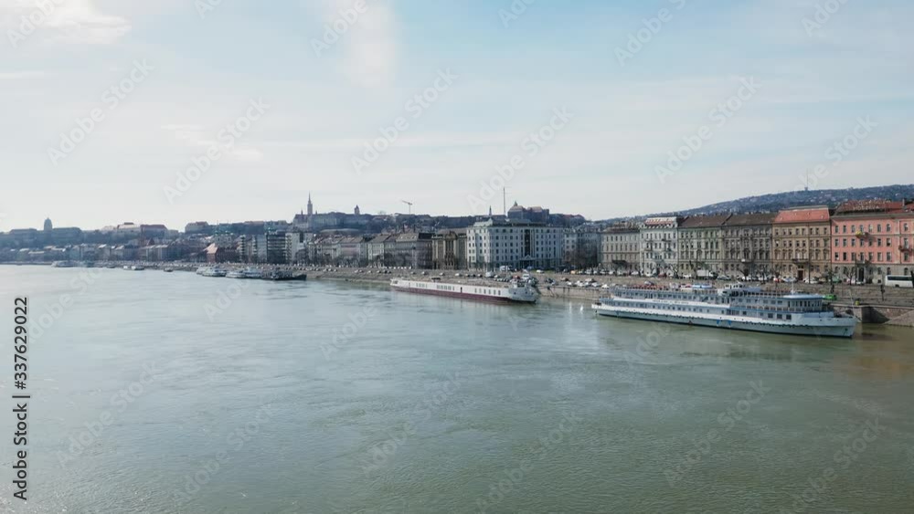 Ferry boats moored in the Danube river. Panorama of Budapest.Hungary. Ferry boats moored in the Danube river. Panorama of Budapest.Hungary.