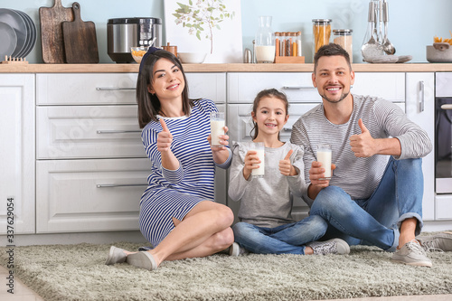 Family drinking milk at home