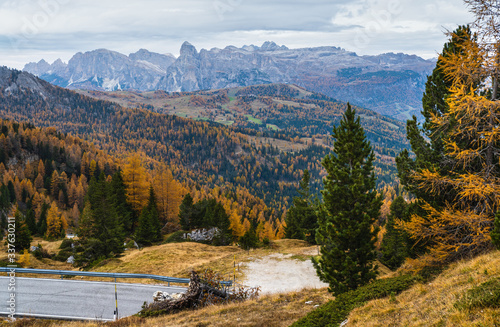 Fototapeta Naklejka Na Ścianę i Meble -  Overcast morning autumn alpine Dolomites mountain scene. Peaceful Valparola Path view, Belluno, Italy.