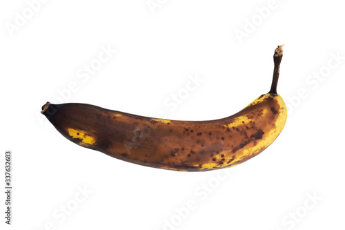 Brown rotten banana isolated on white background.
