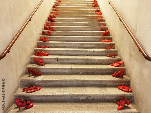 Red shoes on the steps. Demonstration against violence against women.