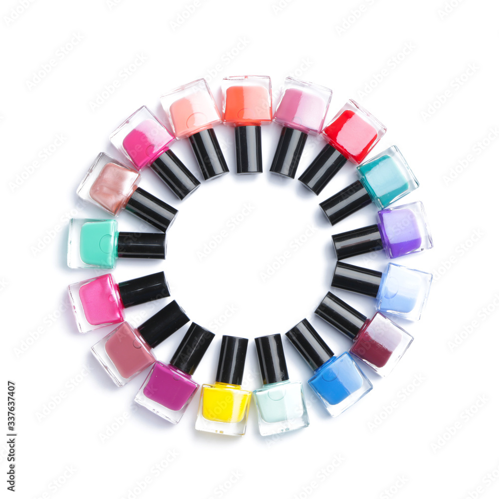 Fototapeta premium Different nail polishes on white background