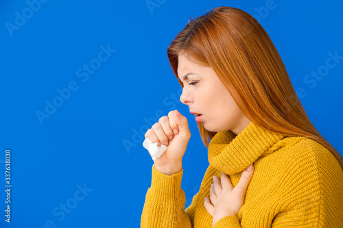 Coughing woman on color bac...
