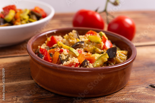 Cous cous with vegetables. oriental recipe that adapts to the characteristics of a vegan and vegetarian dish. Summer food, summer lunch.