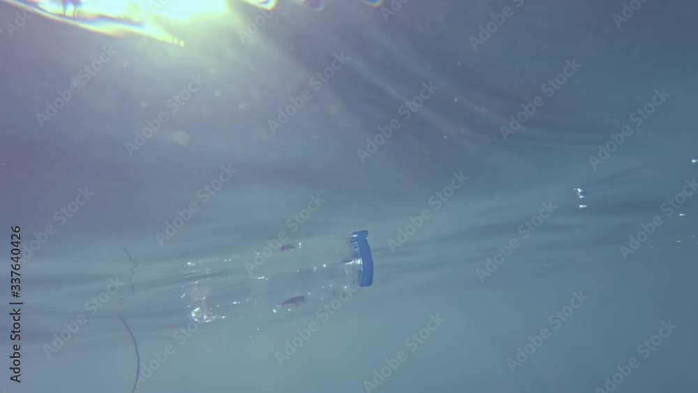 Water bottle ocean plastic floating at sea threatening the health of the planet and sea life Water bottle ocean plastic floating at sea threatening the health of the planet and sea life