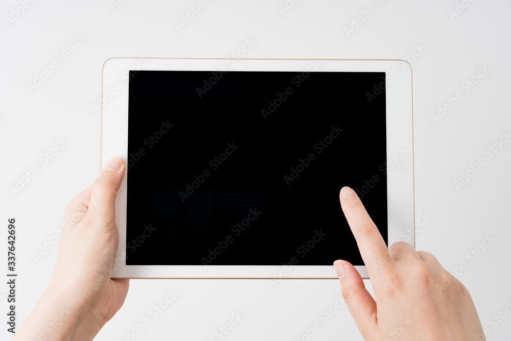 Asian women with tablets in their hands Asian women with tablets in their hands