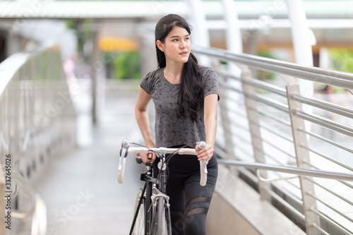 Asian women ride bicycle exercise