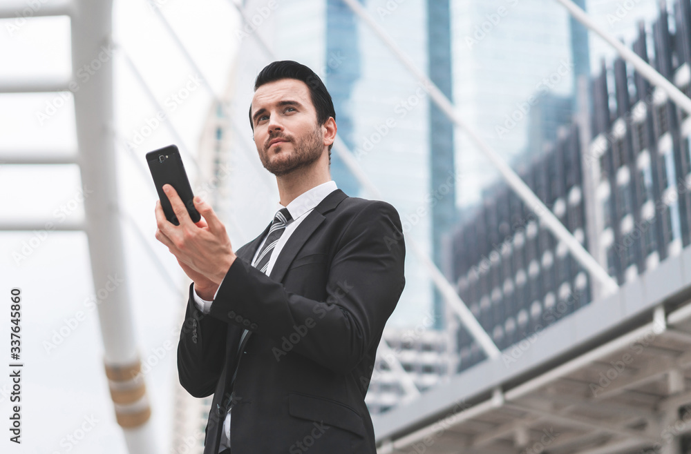 Business caucasian men present lifestyle at workplace outdoors. Businessman holding smart phone social distance online. Concept of business communication, remote conference and technology digital. Business caucasian men present lifestyle at workplace outdoors. Businessman holding smart phone social distance online. Concept of business communication, remote conference and technology digital.