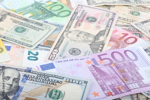 many dollar and euro banknote as background. © ozguroral