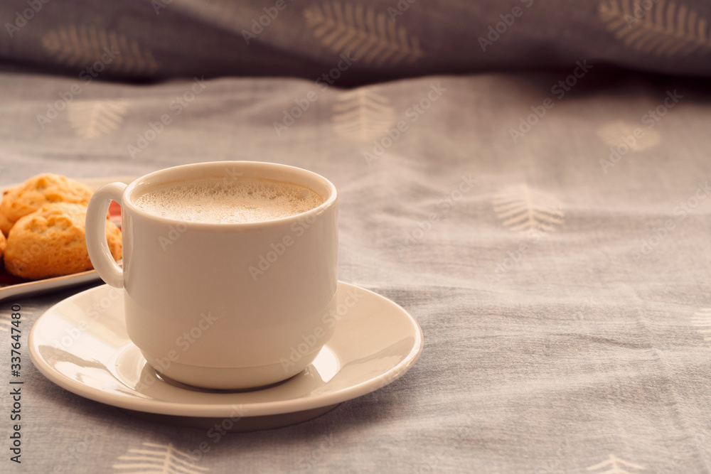 morning breakfast in bed. a cup of strong coffee and cookies on the bed. romantic breakfast with your beloved morning breakfast in bed. a cup of strong coffee and cookies on the bed. romantic breakfast with your beloved
