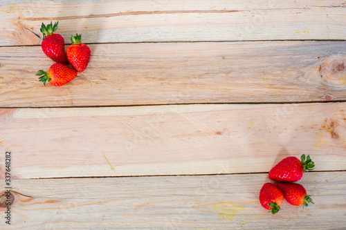Strawberry on wooden  background, top view