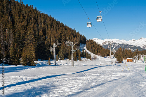 View of an alpine ski slope with cable car lift © Paul Vinten