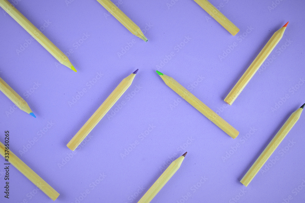 Multi-colored pencils scattered on the background
Multi-colored pencils scattered on the background