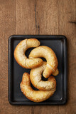 Fresh homemade bagels on a wooden background. Salted bread viewed from above