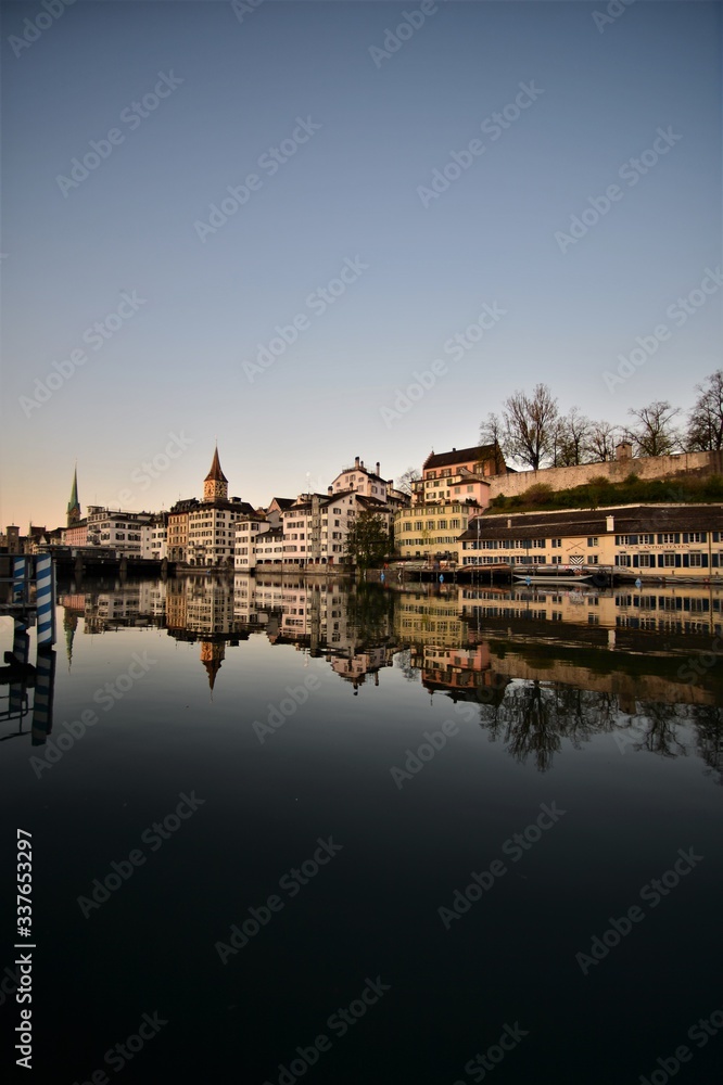 Limmat with old houses facade and Lindenhof in the morning in the city of Zurich Switzerland