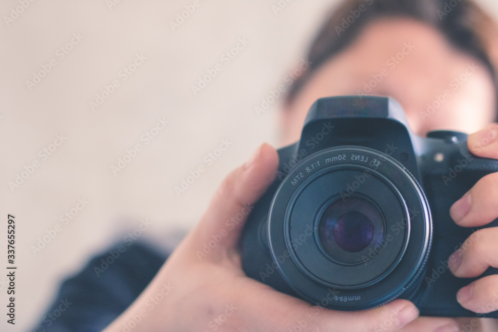 Blurry photo in the mirror of a photographer with a camera. Photo background, banner
