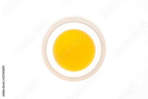 Yellow ball in the centre of white circle on a white background