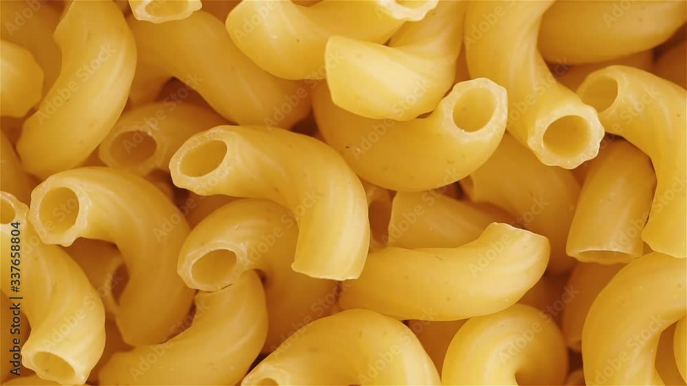 Gently rotating close-up of of elbow macaroni Gently rotating close-up of of elbow macaroni