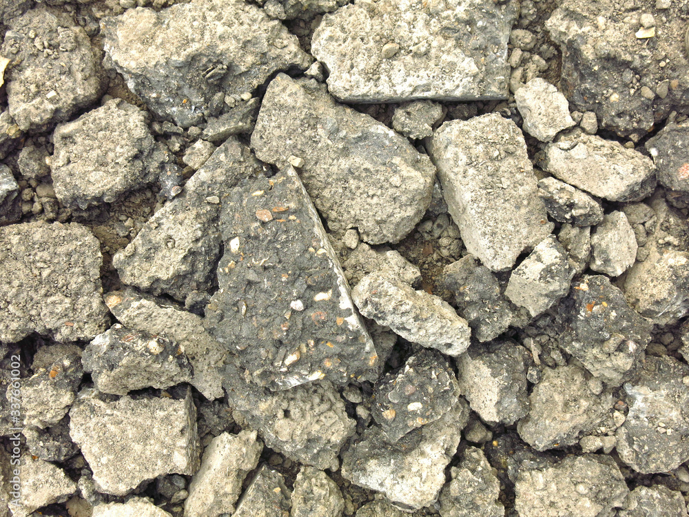 broken gray chunks of asphalt in a pile broken gray chunks of asphalt in a pile