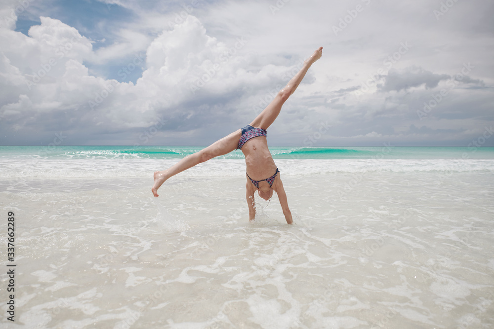 children have fun playing on the beach