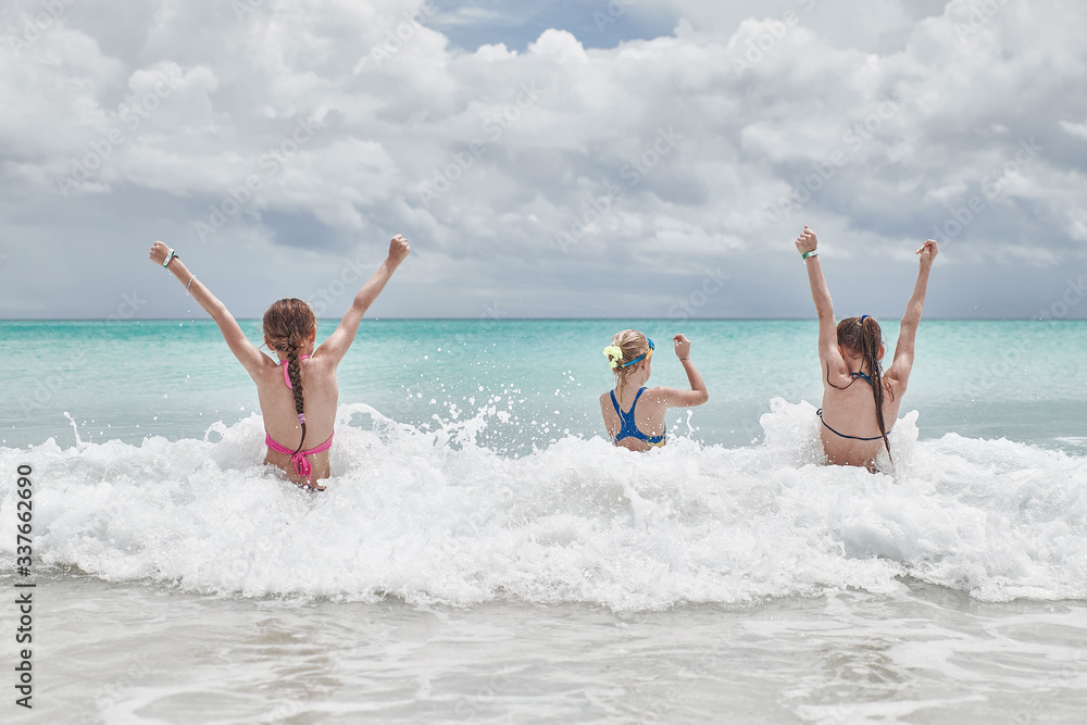 children have fun playing on the beach children have fun playing on the beach