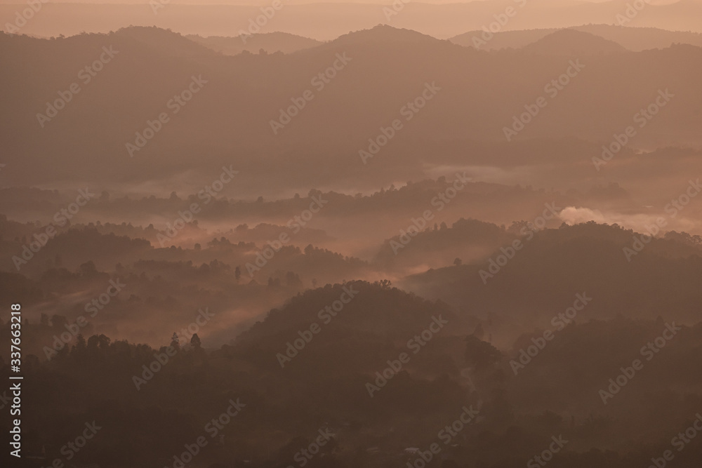 Twilight, sunrise and sea of fog in the morning on the mountains of northern Thailand, during the rainy season.