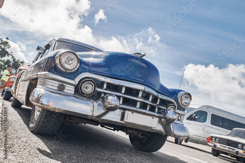beautiful retro cars, palm trees and clouds © Andrey Dydykin