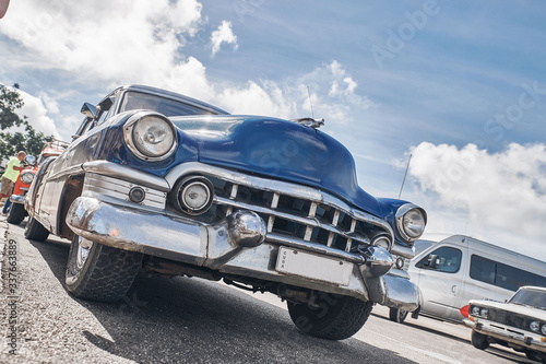 beautiful retro cars, palm trees and clouds