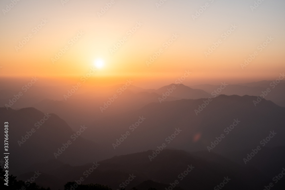 Twilight, sunrise and sea of fog in the morning on the mountains of northern Thailand, during the rainy season.